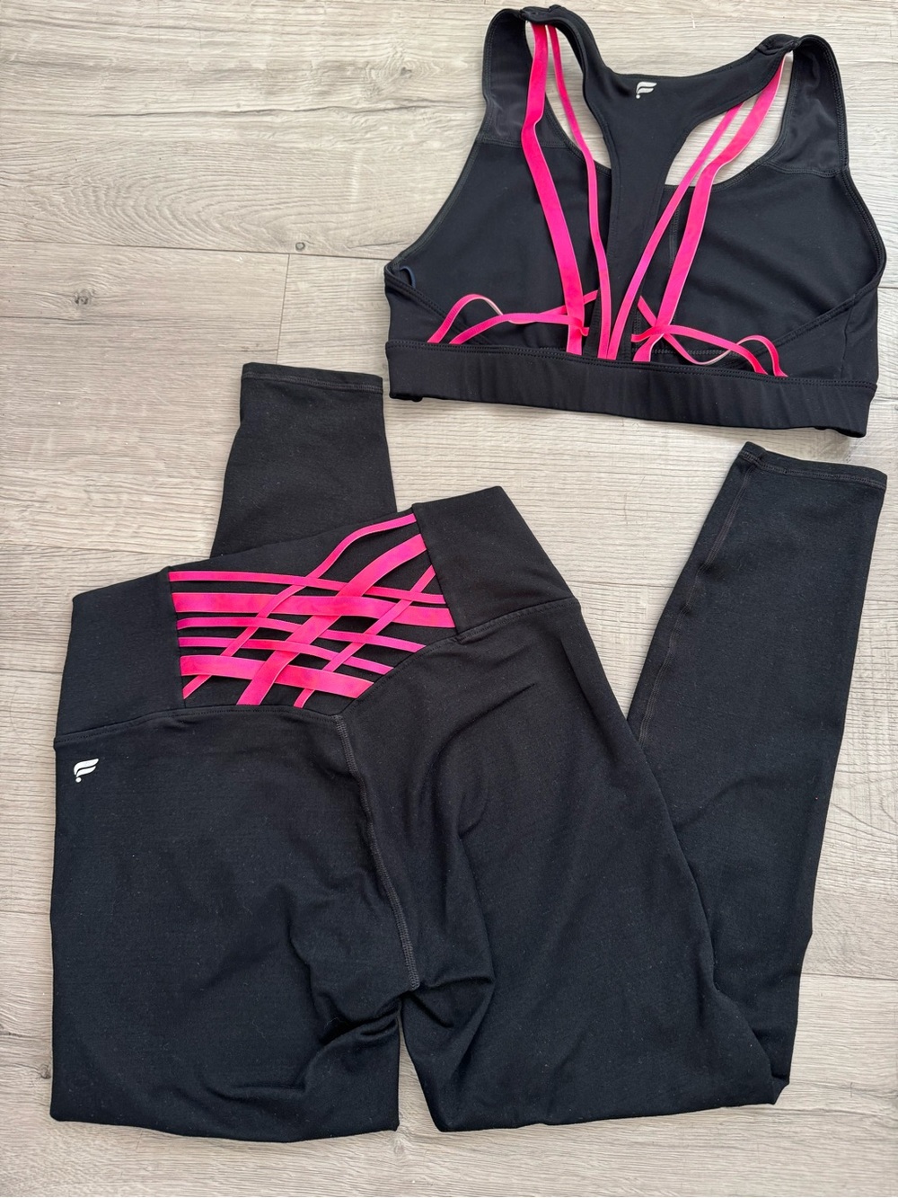 Fabletics Black Leggings and Sports Bra Set with Hot Pink Strappy Detail